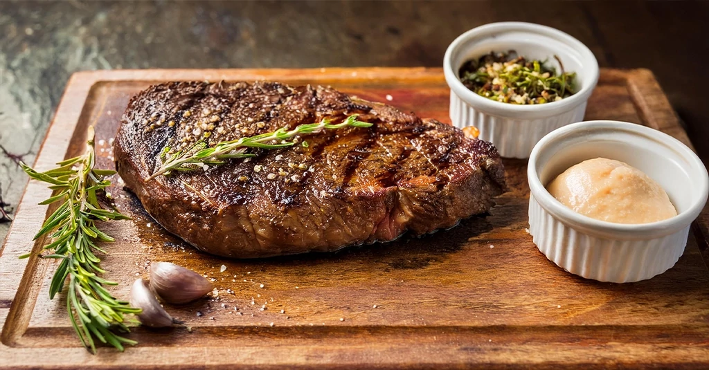 Juicy sirloin tip steak recipe with a golden crust, garnished with rosemary and served with roasted vegetables for a hearty meal.